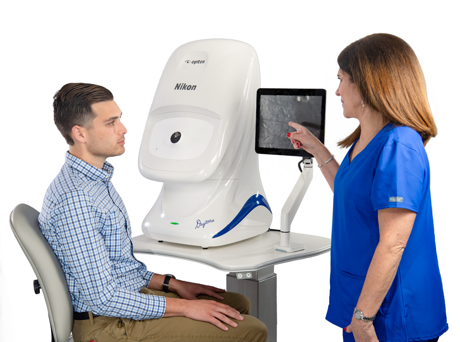 Manufacturer example: a patient and technician beside an Optos Daytona
